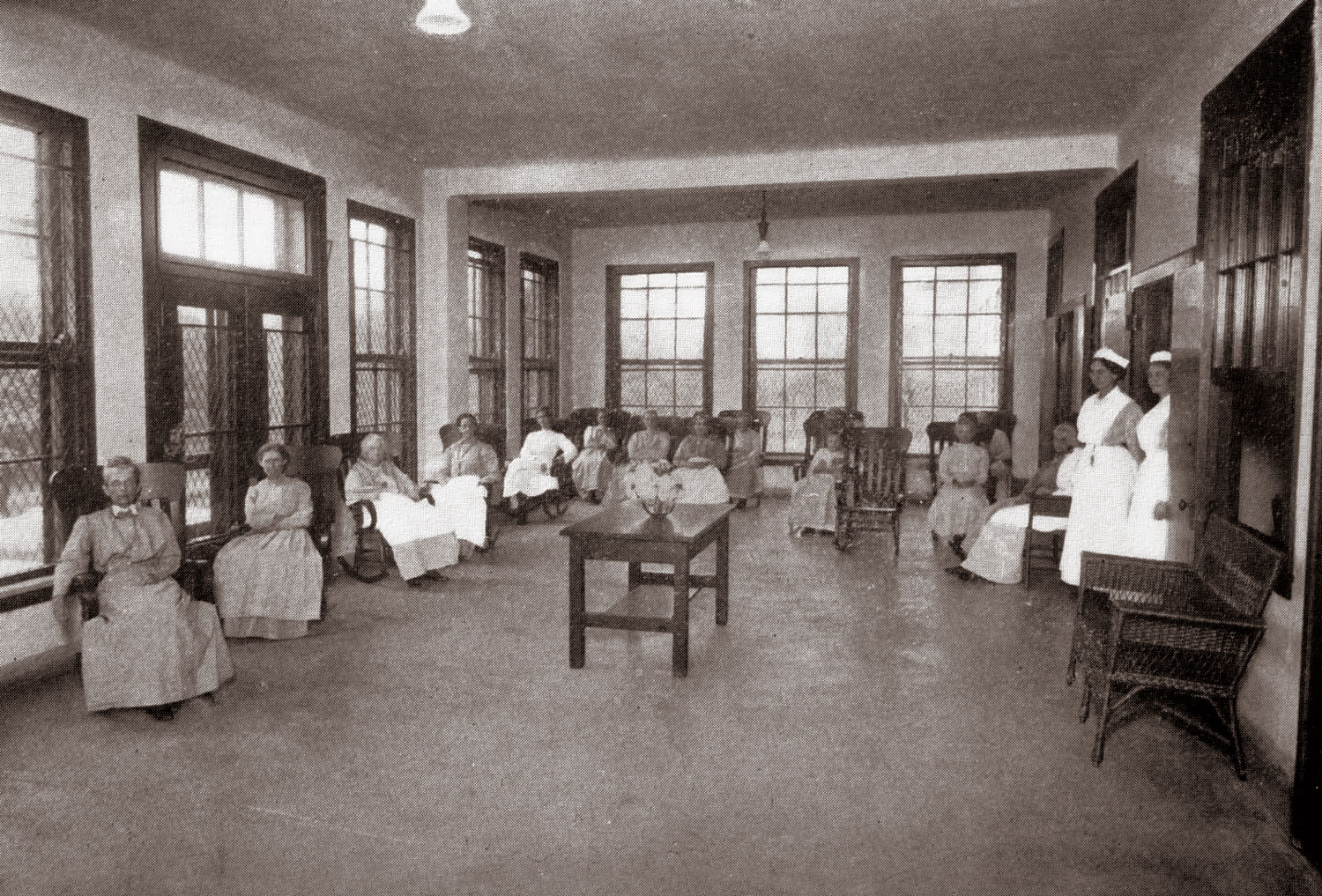 Rocking Chair Therapy taking place in a female ward at a hospital c. 1913 Missouri State archives